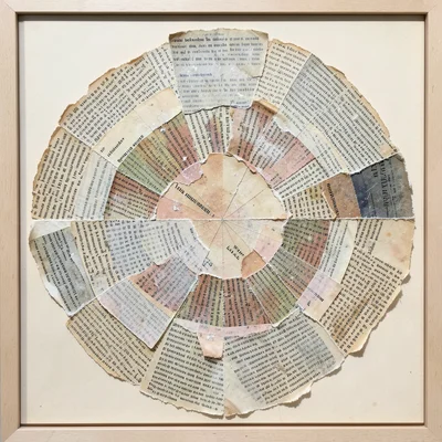 Torn book pages collaged into circular mandala arrangement, text radiating outwa