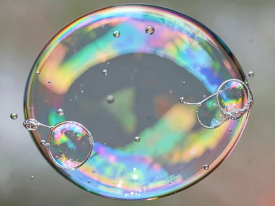 Merging bubbles showing membrane flow