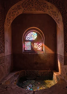 Colored light through qamariya windows in Sana'a, Yemen, half-moon qamariya wind