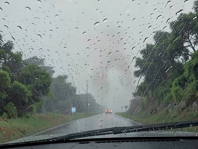Rain on car windshield driving