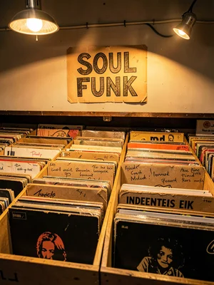 Hand-drawn genre sign above bins