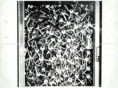 A doorway filled with dense overlapping copies of keys, hundreds of keys