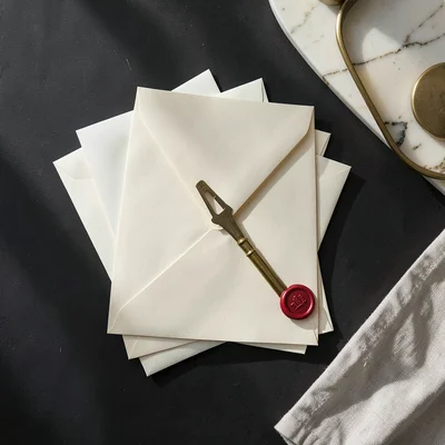 Fanned Envelopes and Brass Letter Opener