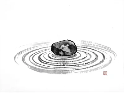 One stone on raked pattern surrounded by nothing