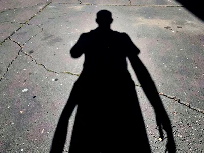 Person shadow longer than frame