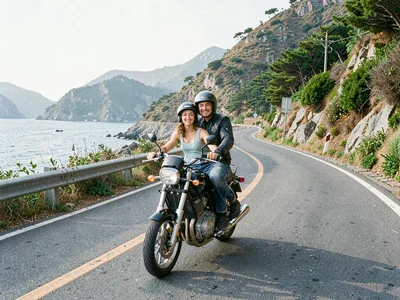 Couple on motorbike on coastal road