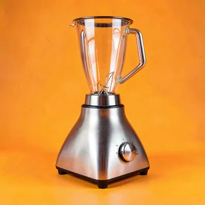 single brushed-steel small kitchen-blender base unit at three-quarter angle on a