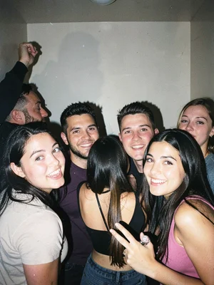 Friends cramped in a photo booth