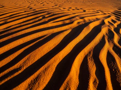 Wind-carved yardang formation, streamlined sand ridge shaped by persistent unidi