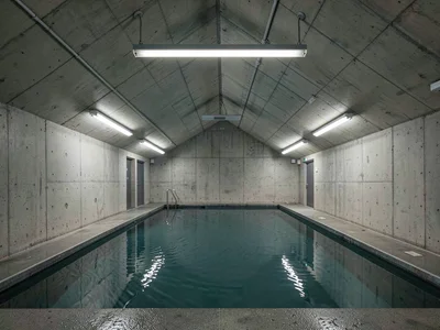 A brutalist swimming pool hall — concrete vaulted ceiling, water light rippling 