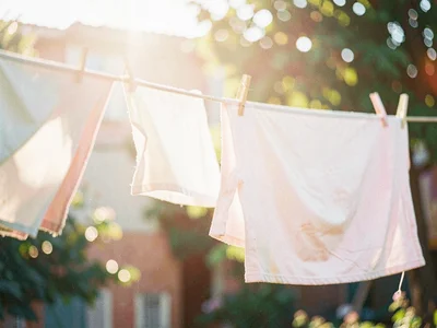 Laundry billowing on a clothesline in afternoon breeze