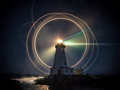 Lighthouse with beam rotation accumulated into full glowing halo