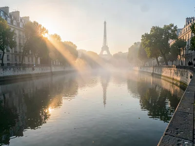 Water surface catching first light through mist