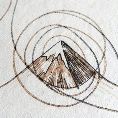 Macro of inked contour lines spiraling around a hand-drawn peak, walnut tones