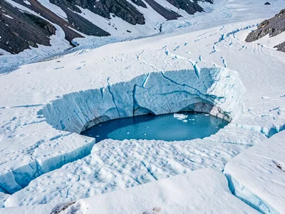Melt pool blue on glacier surface