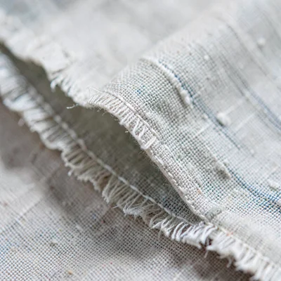 Macro of a folded edge of linen with frayed selvedge