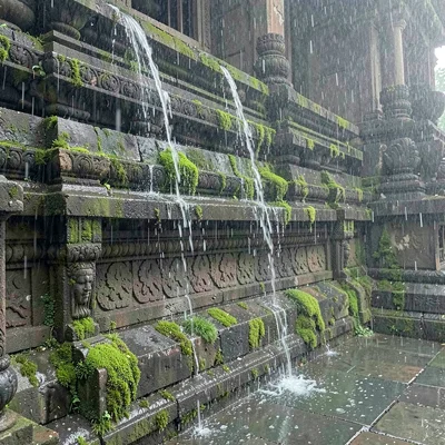 Monsoon season photograph, heavy rain atmosphere, Rainwater streaming down a car