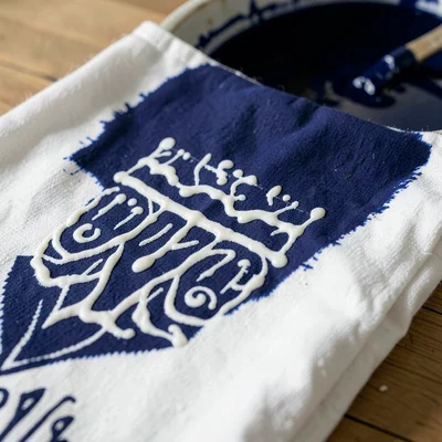 Close-up of the wax resist surface of cloth just before it goes into the dye — w