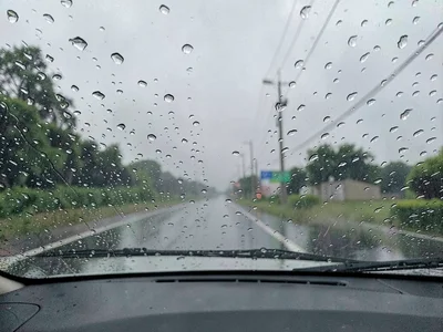 Rain on car windshield driving