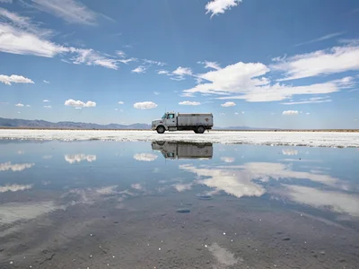 Vehicle appearing to float on reflected sky