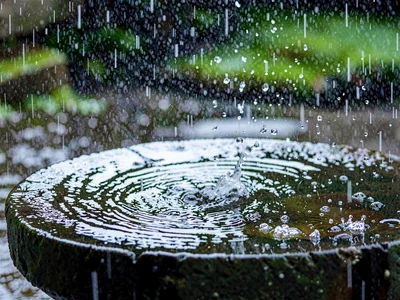 Rain on stone basin creating patterns