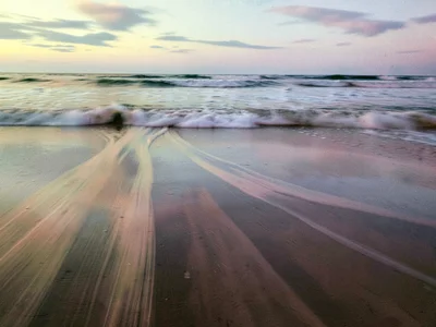 Reflection blur on wet sand