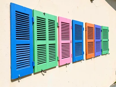 Painted shutters in row