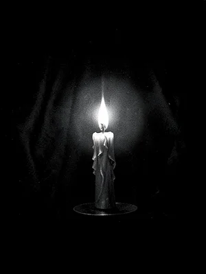 Candle in darkness