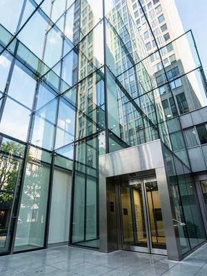 Glass elevator in modern building, ascending transparency, architectural movemen