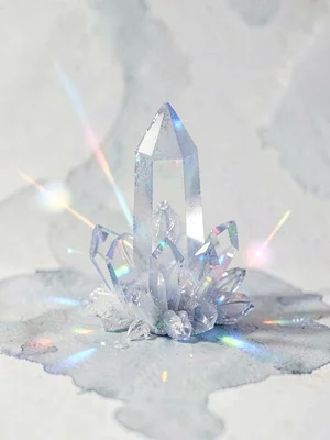 Hexagonal hoar crystal spire rising at a slight tilt from pale grey cold surface