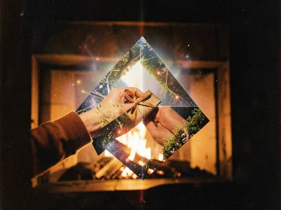 Gift-wrapped hands merged with fireplace scene, layered exposure, warm