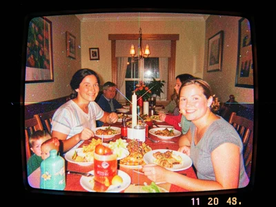 VHS recording of family thanksgiving dinner, 1990s home video, warm degraded col