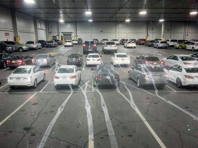 Parking lot showing ghosted traces of every car that came and went in one day
