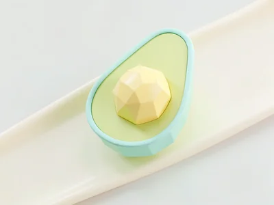 Halved mint-green lowpoly avocado showing a chunky butter-yellow seed sphere, so