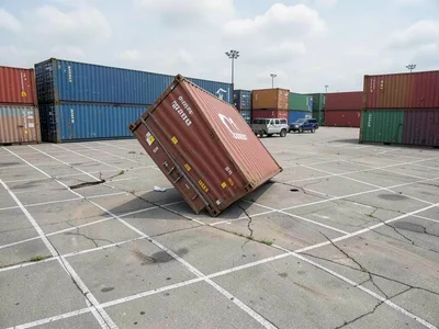Shipping container yard, perfect grid disrupted by one askew container, god's OC