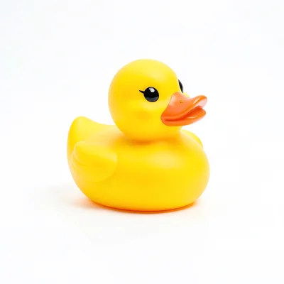 Single yellow rubber duck on infinite white, lit like a diamond advertisement, e