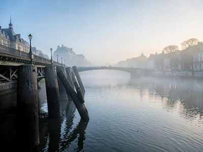Bridge pilings creating rhythm into fog