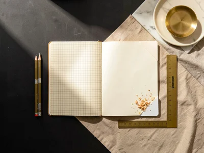 Grid Notebook and Pencils on Linen