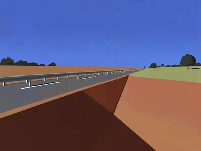 Highway shoulder drops into a copper-red gully beside the road under a vast lapi