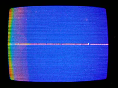 VHS pause on blank blue screen between recordings, perfect blue interrupted by a