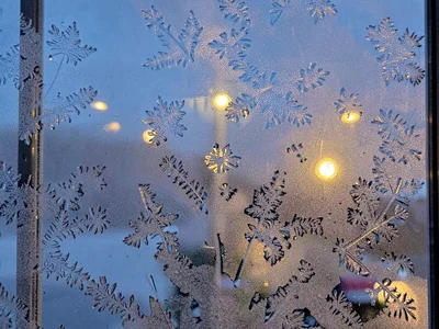 Outside lights visible through frost pattern