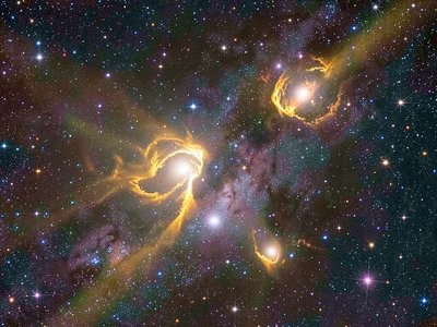 A stellar nursery region where bright-rimmed clouds are being evaporated by radi