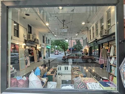 Shop window reflecting street scene