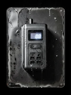 Portable power station with outlets, digital display glowing, wet plate long exp