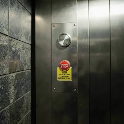 Emergency stop button detail with warning text