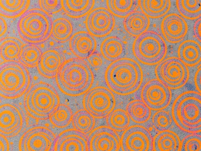 Dense all-over risograph pattern of concentric circles in fluorescent orange on 