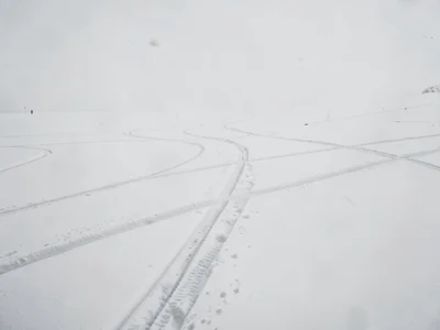 Ski tracks crossing otherwise perfect white
