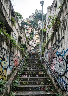 Tropical brutalist São Paulo, Brazil, favela stairway carved into hillside betwe
