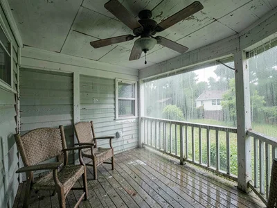 Porch in summer humidity, everything slightly damp, ceiling fan ineffective