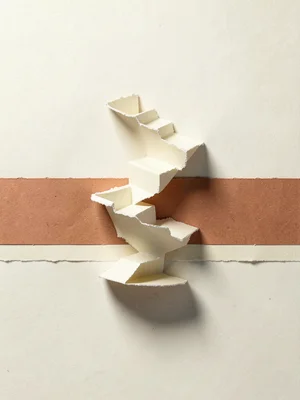 Papercraft staircase spirals upward into nothing on a cream backdrop with a terr